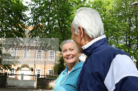 Older couple walking in park