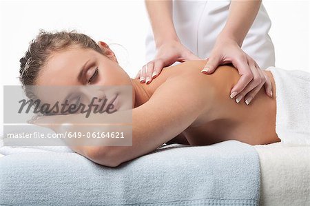Smiling woman having back massage