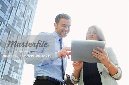 Business people using tablet computer