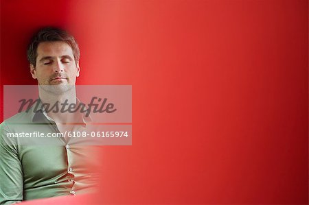Man sitting with eyes closed