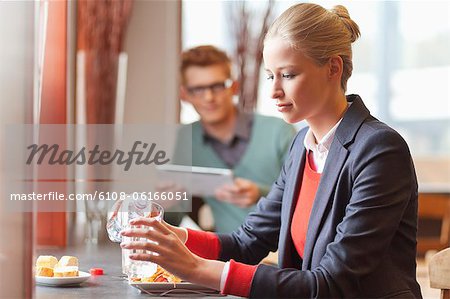 Businesswoman having lunch in a restaurant