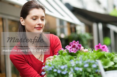 Woman looking at flowers in a flower shop