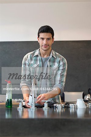 Man washing dishes in the kitchen