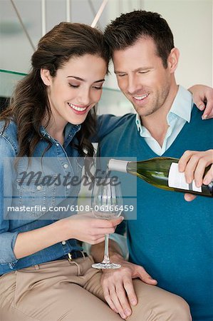 Couple drinking wine in the kitchen