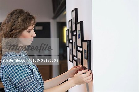 Interior designer measuring painting size