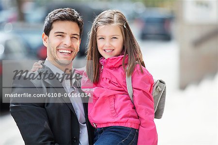 Portrait of a man carrying his daughter