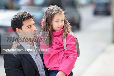 Man carrying his daughter