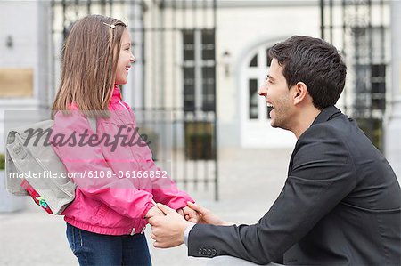 Man talking to his daughter