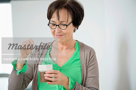 Close-up of a woman having coffee