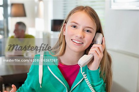 Portrait of a girl talking on a phone and smiling