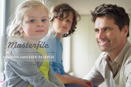 Man with their children at home