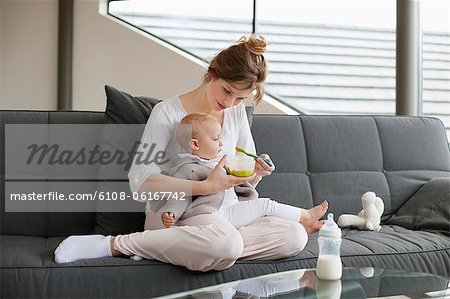 Woman feeding her daughter