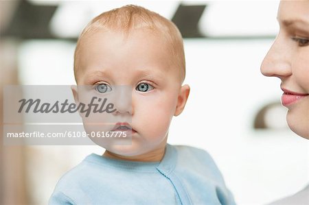 Close-up of a woman with her baby girl