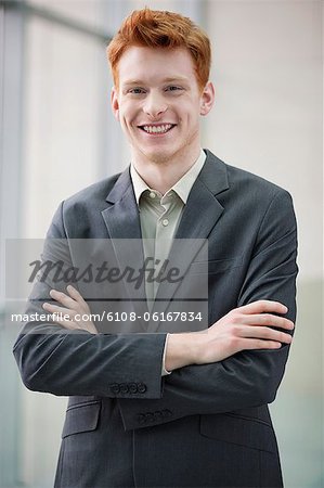 Portrait of a businessman smiling with arms crossed