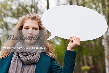 Woman holding a speech bubble