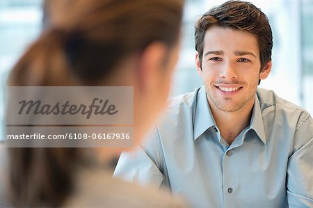 Business executive discussing with her client Business executive discussing with her client