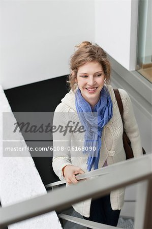 Woman moving up stairs