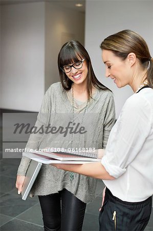 Two businesswomen discussing in an office