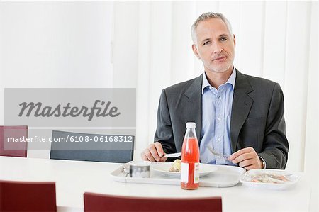 Businessman having lunch in the office