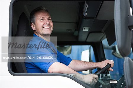 Man at steering wheel in truck