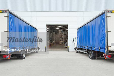 Trucks parked outside distribution warehouse