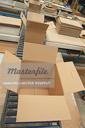 Empty cardboard boxes on conveyor belt