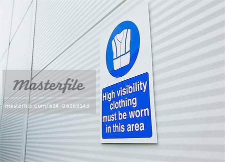 High visibility clothing sign on warehouse door
