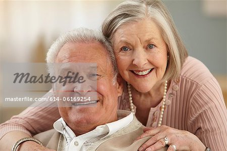 Senior couple looking at camera, portrait