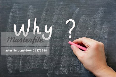 Why - written on a smudged chalkboard with chalk