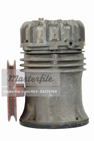 Old air compressor with pulley, isolated on white background
