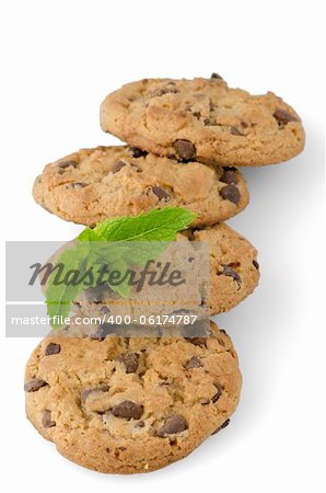 Chocolate cookies with mint leaves isolated on white background.