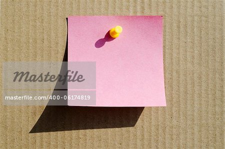 pink color note paper with pin