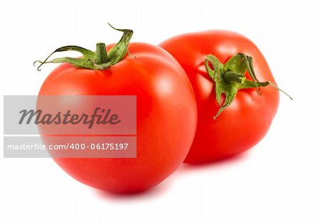 Two red tomatoes isolated over white background