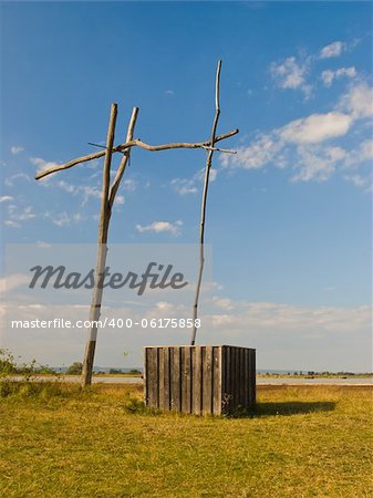 Old wooden well in dry prairie land