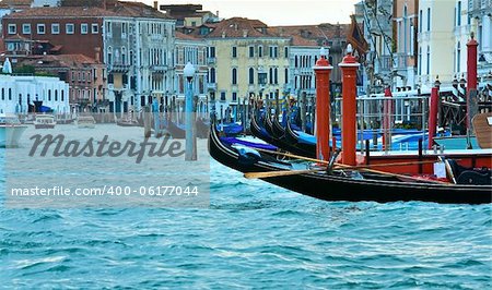 Nice summer venetian Grand Canal view with gondolas on water (Venice, Italy)