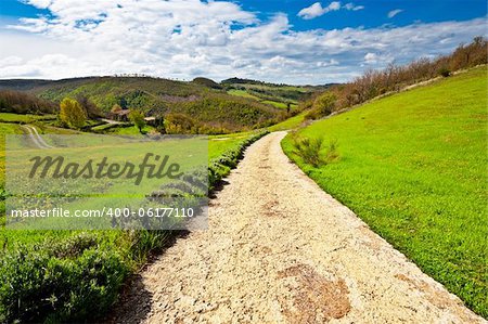 Dirt Road Leading to the Farmhouse in Tuscany, Italy