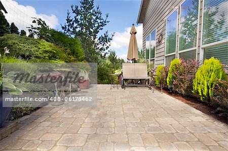 Garden Backyard Paver Patio with Chairs Umbrella Plants Pots Trees and Decoration