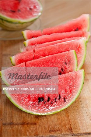 fresh ripe watermelon sliced on a  wood table