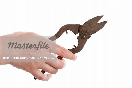 Hand holding old tin snips isolated on white