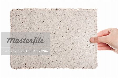 Handmade paper in woman hand isolated on white background