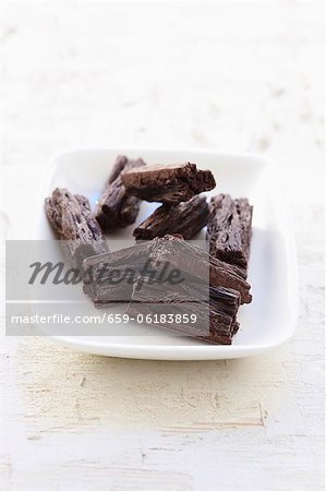 A plate of flaked chocolate bars