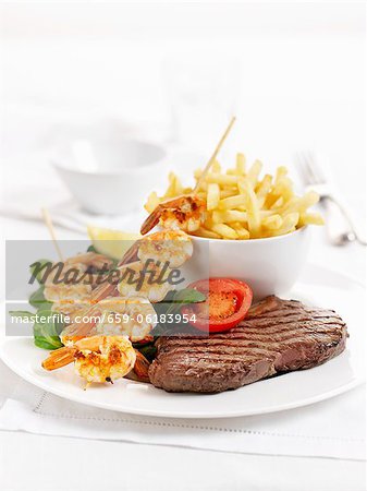 Surf and Turf (beef steak and a prawn kebab) with chips