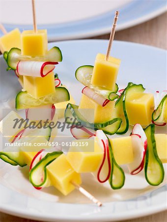 Cheese, cucumber and radishes on cocktail sticks