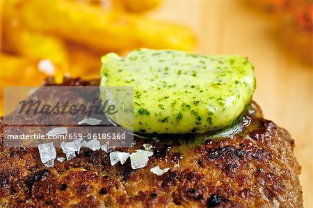 Herb butter melting on burger