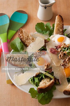 Salad with Arugula, Prosciutto, Fried Egg, Walnuts, Parmesan and Cheese Toasts