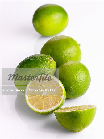 Several limes, whole and halved