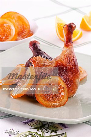 Roast duck leg with oranges