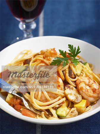 Plate of Shrimp and Vegetable Spaghetti with Fork