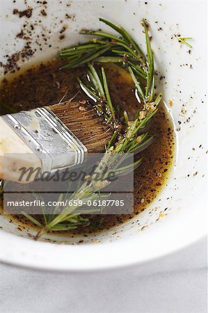 Rosemary Marinade in a Bowl with a Basting Brush