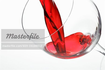 Red wine being poured into a glass